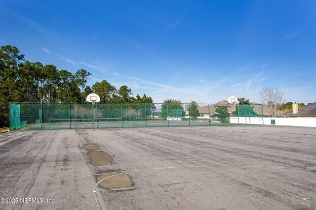 view of sport court featuring community basketball court and fence
