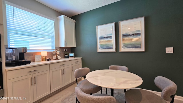 dining area featuring light wood-type flooring