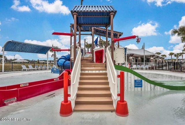 communal playground featuring fence