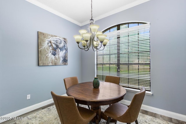 32238 Settlers Ridge Dr, Bryceville, FL 32009 - dining area with a chandelier, wood finished floors, crown molding, and baseboards