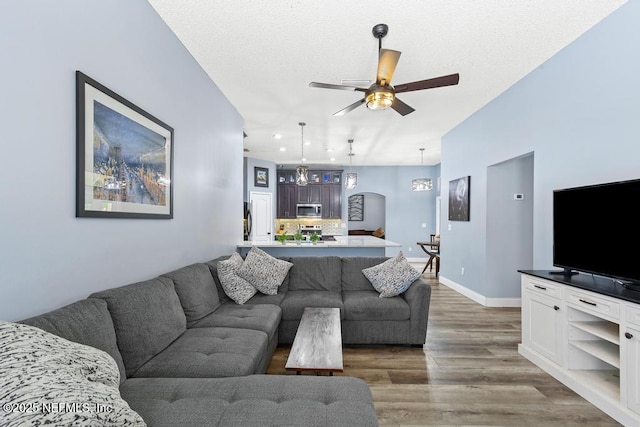32238 Settlers Ridge Dr, Bryceville, FL 32009 - living room featuring wood finished floors, a ceiling fan, baseboards, and recessed lighting