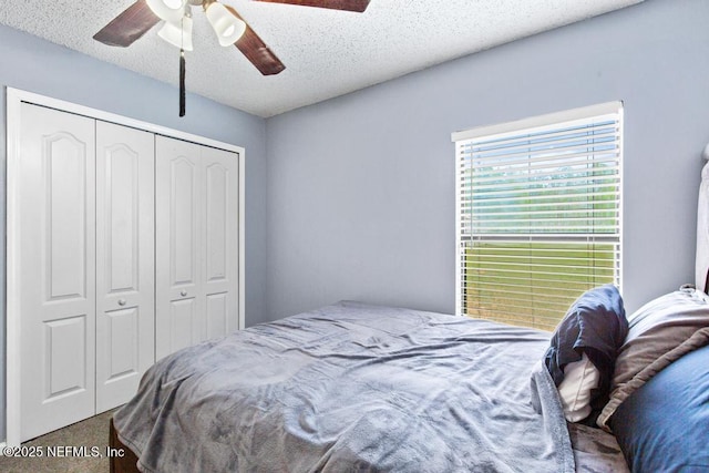 32238 Settlers Ridge Dr, Bryceville, FL 32009 - carpeted bedroom with a closet, a textured ceiling, and ceiling fan