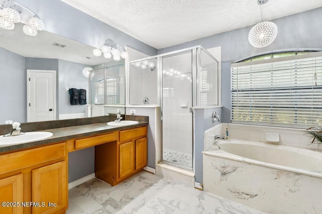 32238 Settlers Ridge Dr, Bryceville, FL 32009 - full bathroom with a stall shower, a garden tub, double vanity, a textured ceiling, and marble look tile flooring