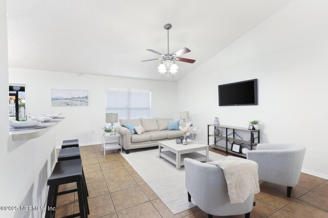 12394 Glenn Hollow Dr, Jacksonville, FL 32226 - tiled living area with lofted ceiling, ceiling fan, healthy amount of natural light, and baseboards