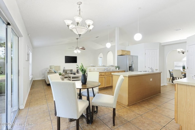 12394 Glenn Hollow Dr, Jacksonville, FL 32226 - dining area with a chandelier, light tile patterned flooring, healthy amount of natural light, a ceiling fan, and lofted ceiling