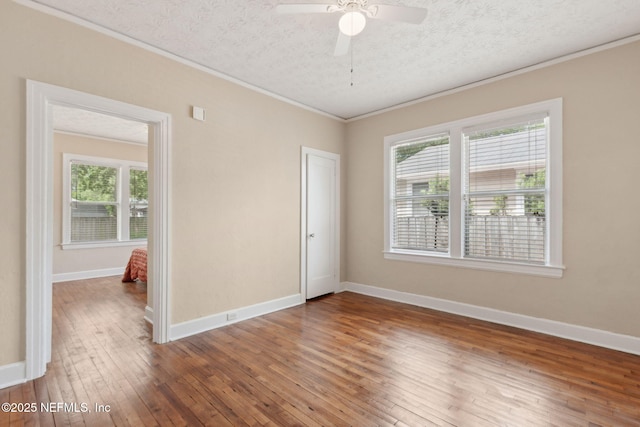4534 College St, Jacksonville, FL 32205 - unfurnished room featuring crown molding, wood-type flooring, healthy amount of natural light, baseboards, and ceiling fan