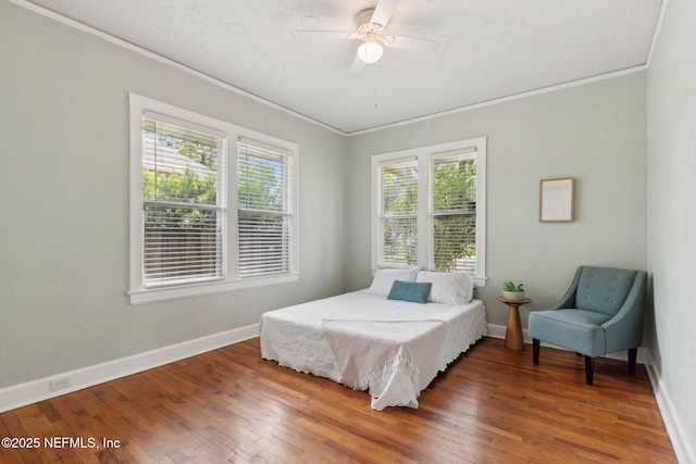4534 College St, Jacksonville, FL 32205 - bedroom featuring crown molding, wood-type flooring, baseboards, and a ceiling fan