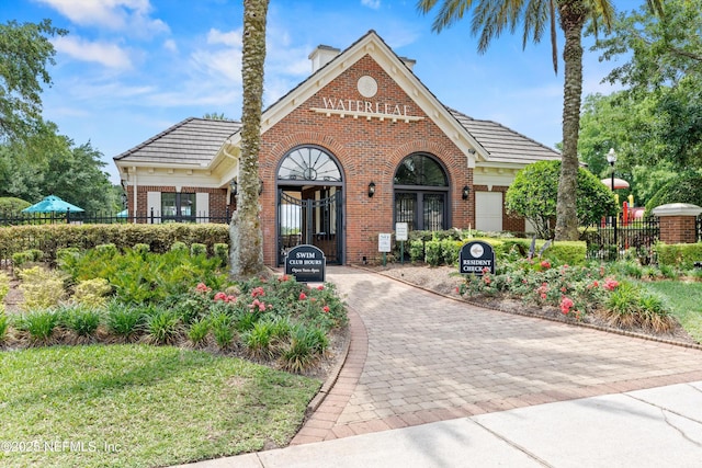 766 Candlebark Dr, Jacksonville, FL 32225 - view of front of home with brick siding and fence