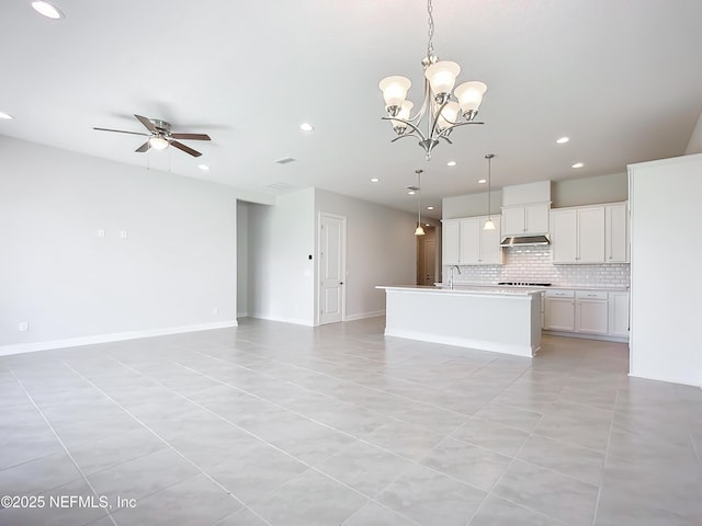 232 Caiden Dr, Ponte Vedra, FL 32081 - unfurnished living room featuring a sink, light tile patterned floors, ceiling fan with notable chandelier, and recessed lighting