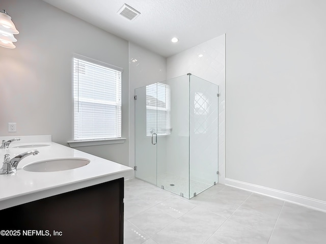 232 Caiden Dr, Ponte Vedra, FL 32081 - bathroom featuring a sink, tile patterned floors, a stall shower, and double vanity