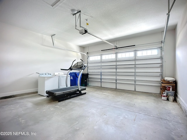 232 Caiden Dr, Ponte Vedra, FL 32081 - garage featuring separate washer and dryer, a garage door opener, and baseboards