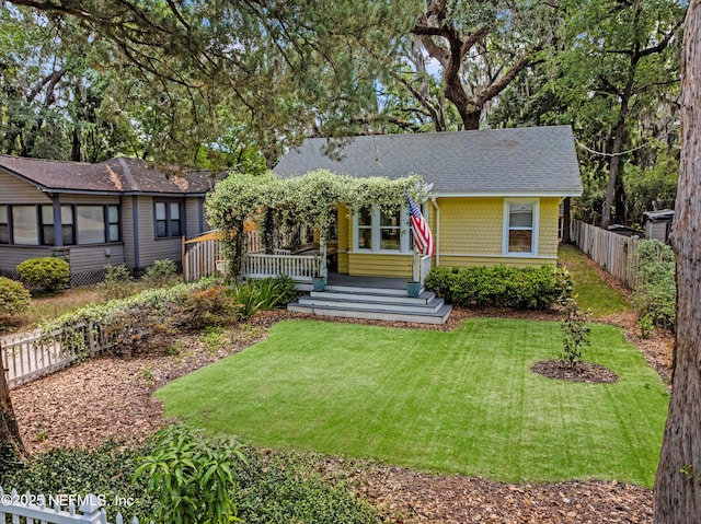2720 Apache Ave, Jacksonville, FL 32210 - single story home with a front yard, a fenced backyard, and roof with shingles