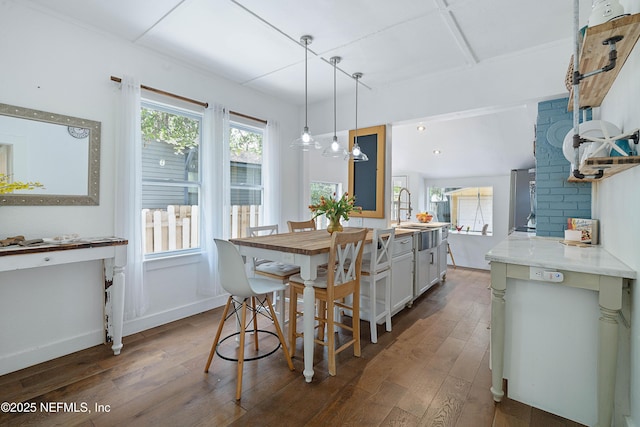 2720 Apache Ave, Jacksonville, FL 32210 - dining space with baseboards and dark wood-style floors