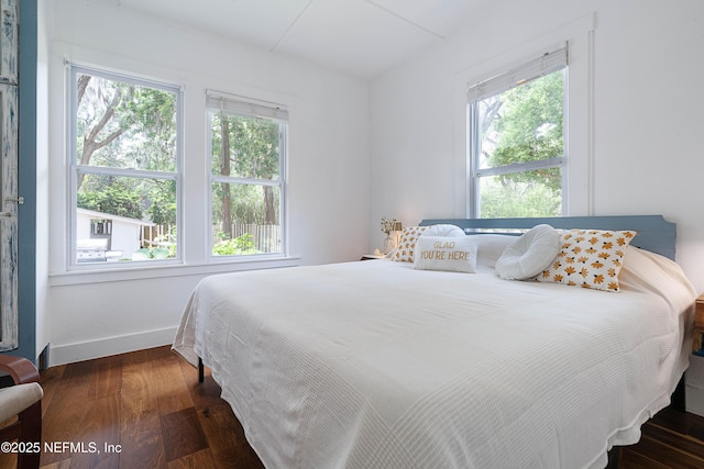 2720 Apache Ave, Jacksonville, FL 32210 - bedroom with baseboards, multiple windows, and wood finished floors