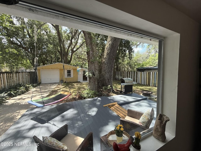 2720 Apache Ave, Jacksonville, FL 32210 - exterior space featuring an outdoor structure, fence, a deck, area for grilling, and driveway
