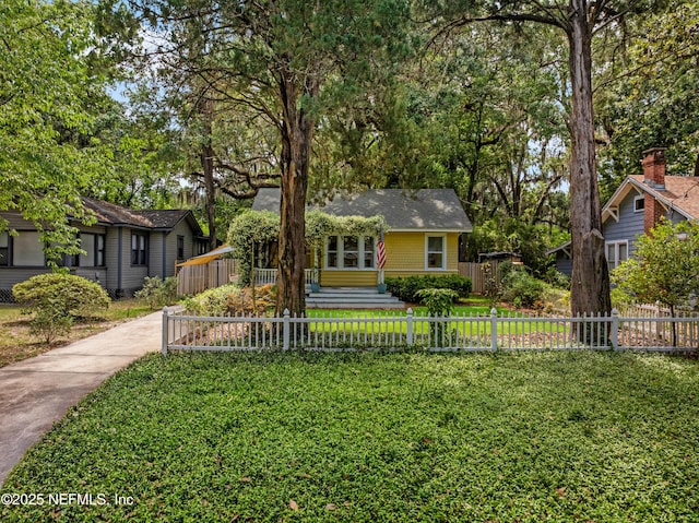 2720 Apache Ave, Jacksonville, FL 32210 - view of front of home featuring a front lawn and a fenced front yard