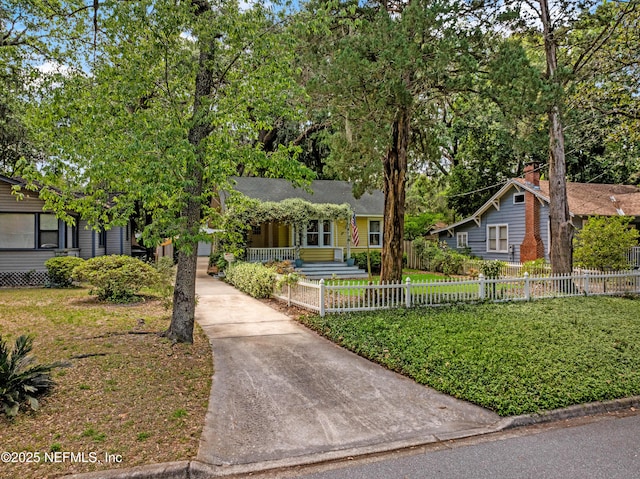 2720 Apache Ave, Jacksonville, FL 32210 - ranch-style home featuring a porch, driveway, and a fenced front yard