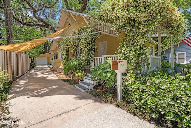 2720 Apache Ave, Jacksonville, FL 32210 - exterior space with a garage, fence, and an outbuilding