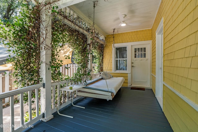 2720 Apache Ave, Jacksonville, FL 32210 - wooden terrace with covered porch and a ceiling fan