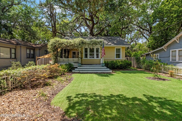 2720 Apache Ave, Jacksonville, FL 32210 - view of front of property with a front lawn and fence