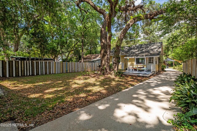 2720 Apache Ave, Jacksonville, FL 32210 - view of yard featuring a deck and fence