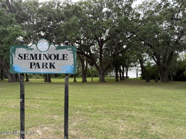 2720 Apache Ave, Jacksonville, FL 32210 - community sign featuring a lawn