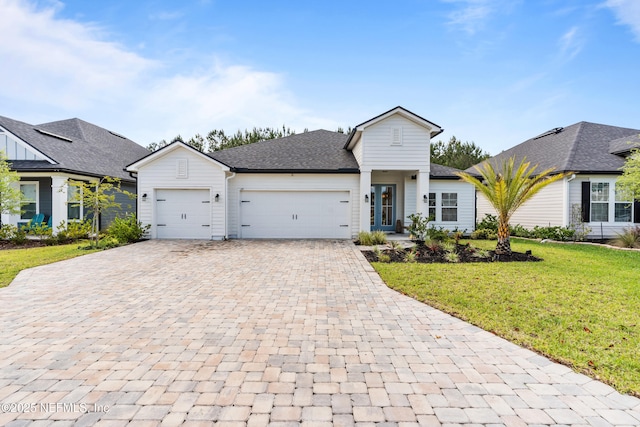 49 Golden Fern Dr, Saint Augustine, FL 32092 - view of front of house with a front yard, decorative driveway, and a garage