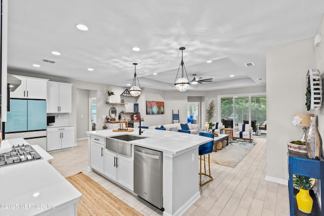 49 Golden Fern Dr, Saint Augustine, FL 32092 - kitchen featuring stainless steel dishwasher, visible vents, a sink, built in fridge, and light countertops