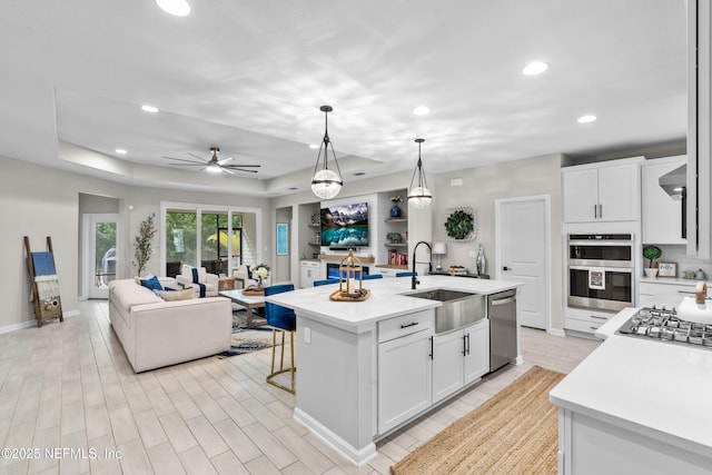 49 Golden Fern Dr, Saint Augustine, FL 32092 - kitchen with a sink, open floor plan, light countertops, and appliances with stainless steel finishes