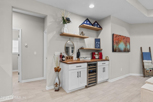 49 Golden Fern Dr, Saint Augustine, FL 32092 - bar with wood tiled floor, baseboards, indoor wet bar, and beverage cooler