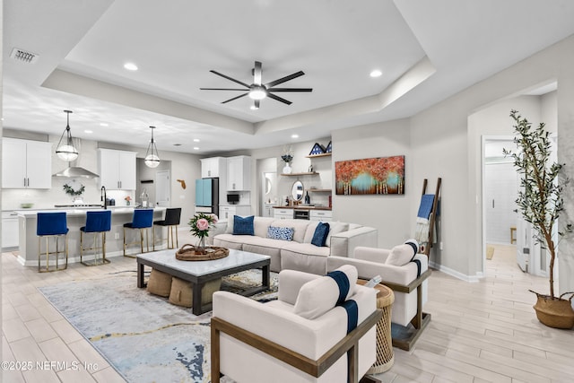 49 Golden Fern Dr, Saint Augustine, FL 32092 - living room with a tray ceiling, visible vents, ceiling fan, and recessed lighting