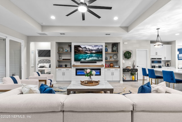 49 Golden Fern Dr, Saint Augustine, FL 32092 - living area with ceiling fan, a raised ceiling, built in features, and recessed lighting
