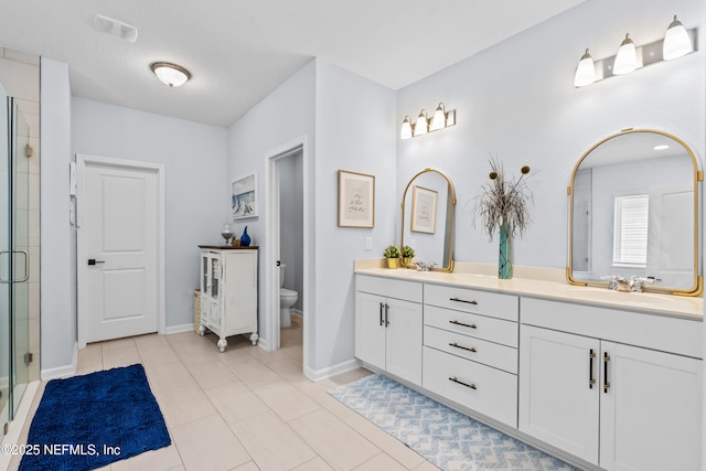49 Golden Fern Dr, Saint Augustine, FL 32092 - full bathroom with a shower stall, toilet, double vanity, and a sink
