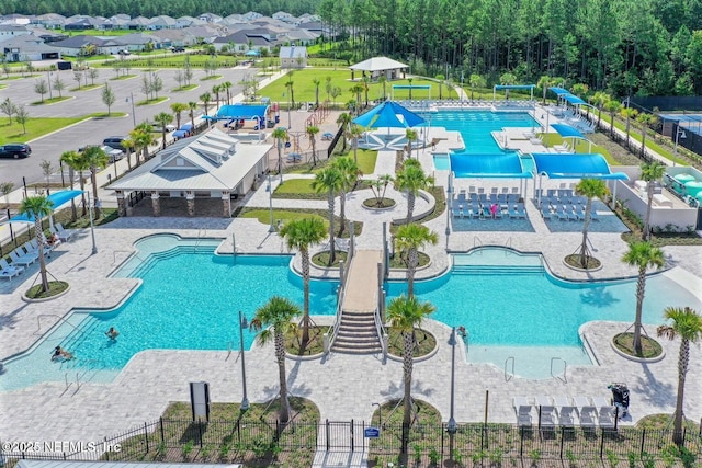 49 Golden Fern Dr, Saint Augustine, FL 32092 - community pool featuring a water slide, fence, and a patio