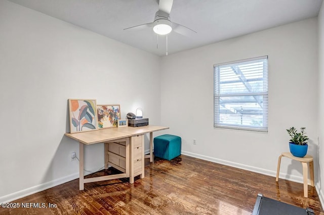 office featuring ceiling fan, baseboards, and dark wood-type flooring