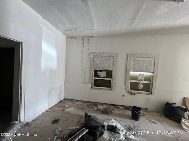 2024 N Davis St, Jacksonville, FL 32209 - unfurnished living room featuring a textured ceiling