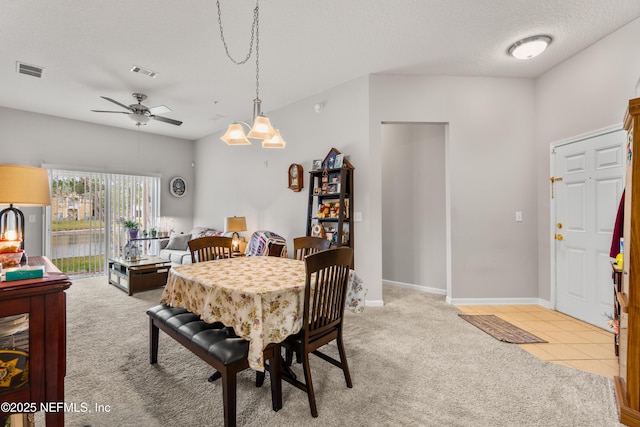 108 Brannan Pl Unit 103, Saint Johns, FL 32259 - dining area with a ceiling fan, light colored carpet, a textured ceiling, and baseboards