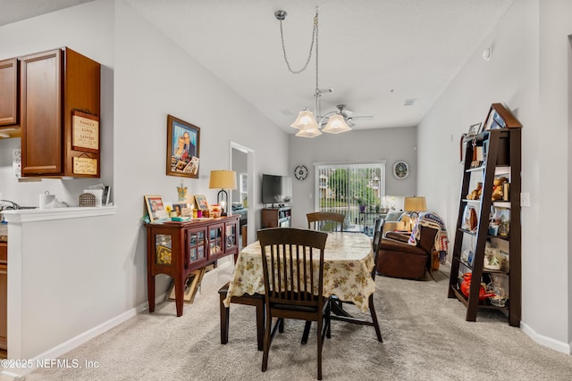 108 Brannan Pl Unit 103, Saint Johns, FL 32259 - dining space with light colored carpet, a chandelier, and baseboards