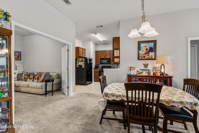 108 Brannan Pl Unit 103, Saint Johns, FL 32259 - dining space with light carpet and a textured ceiling