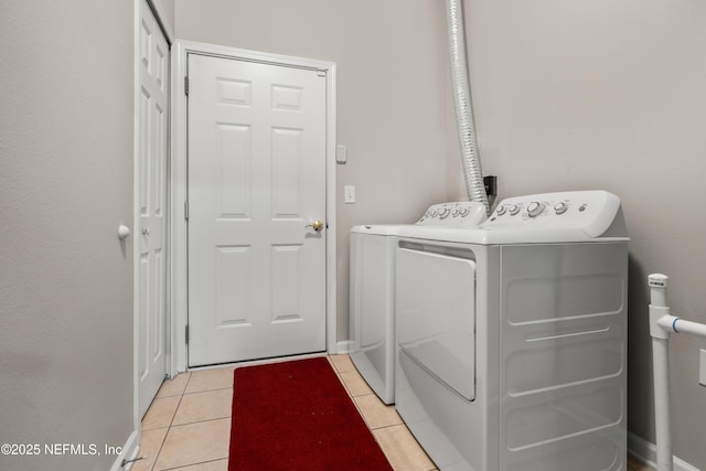 108 Brannan Pl Unit 103, Saint Johns, FL 32259 - washroom featuring washing machine and clothes dryer and light tile patterned floors