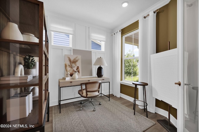 office area featuring baseboards and wood finished floors
