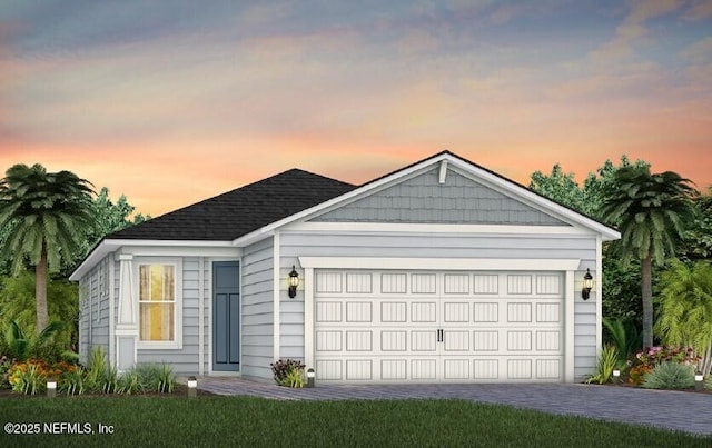 ranch-style house with driveway and a garage