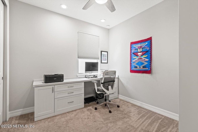 home office featuring a ceiling fan, baseboards, recessed lighting, and light carpet