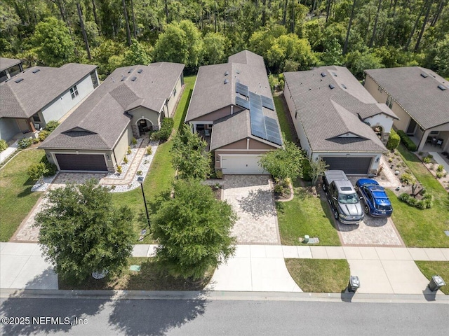 birds eye view of property with a residential view