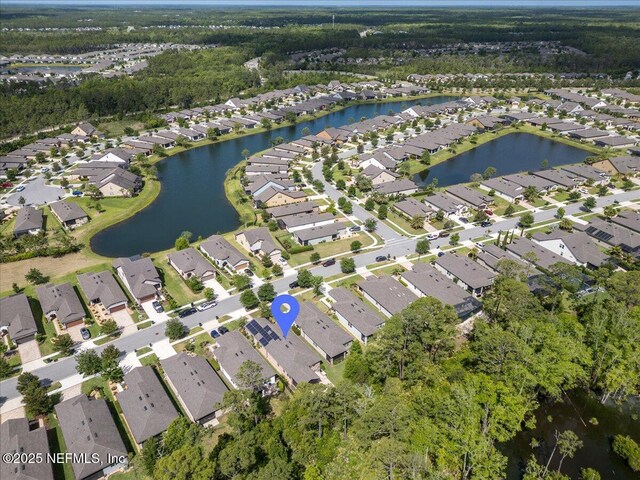 bird's eye view with a water view and a residential view
