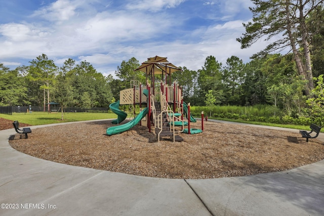 communal playground featuring fence
