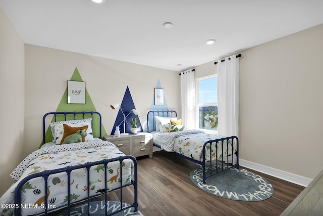 bedroom with baseboards, recessed lighting, and wood finished floors