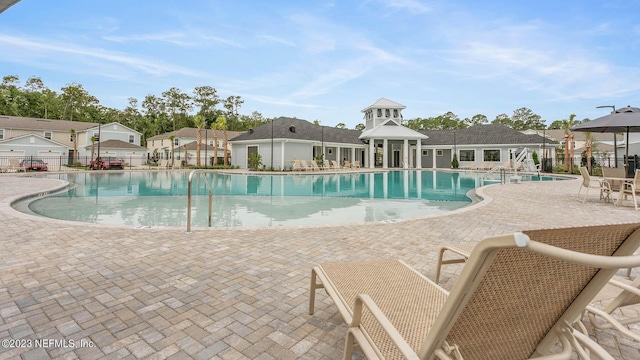 419 Seaport Breeze Rd, Saint Augustine, FL 32095 - pool featuring fence, a patio area, and a residential view