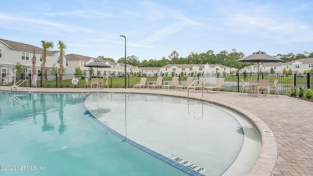419 Seaport Breeze Rd, Saint Augustine, FL 32095 - community pool with a patio, fence, and a residential view
