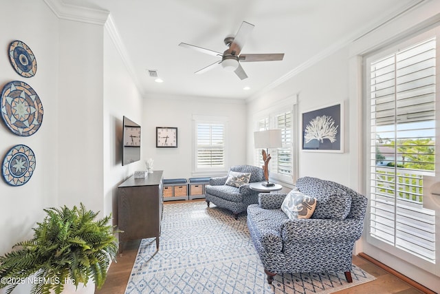 sitting room featuring crown molding, ceiling fan, recessed lighting, wood finished floors, and visible vents